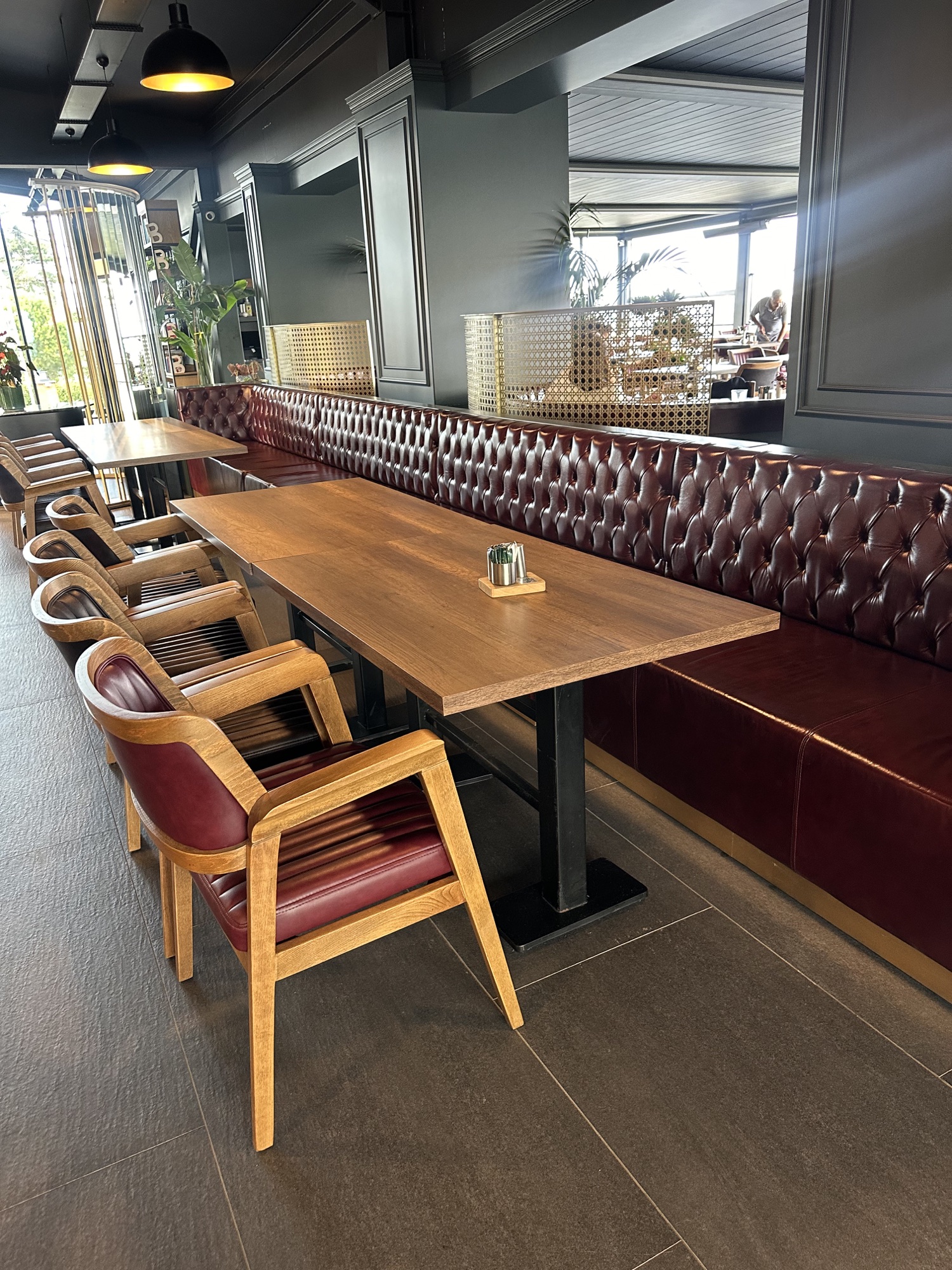 Close-up of a long custom diamond-tufted restaurant banquette